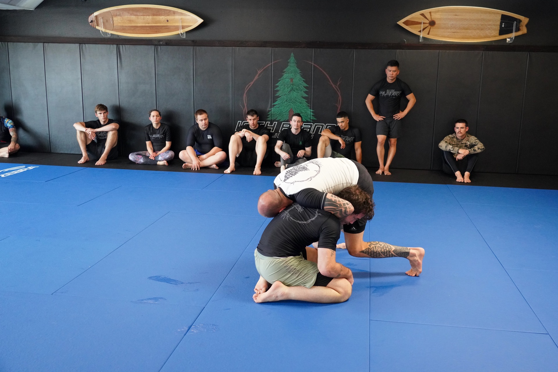 10th Planet Tigard — students practicing ground technique