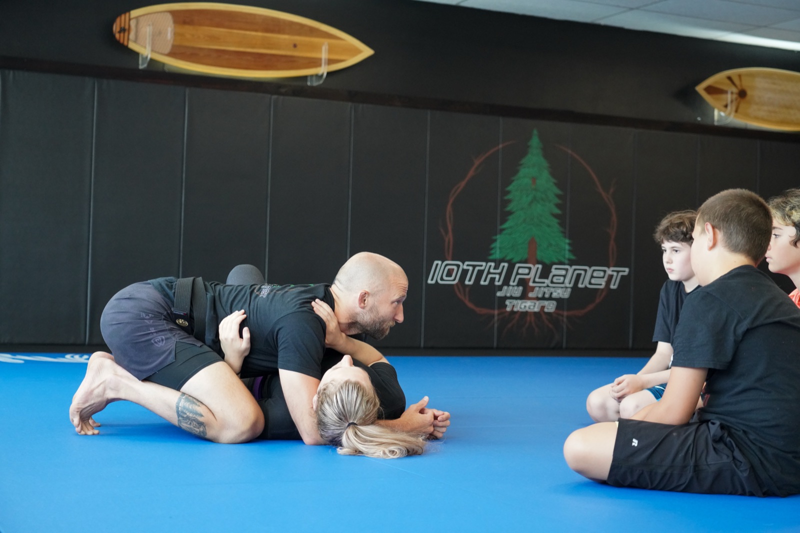 Grappling exchange on the blue mats