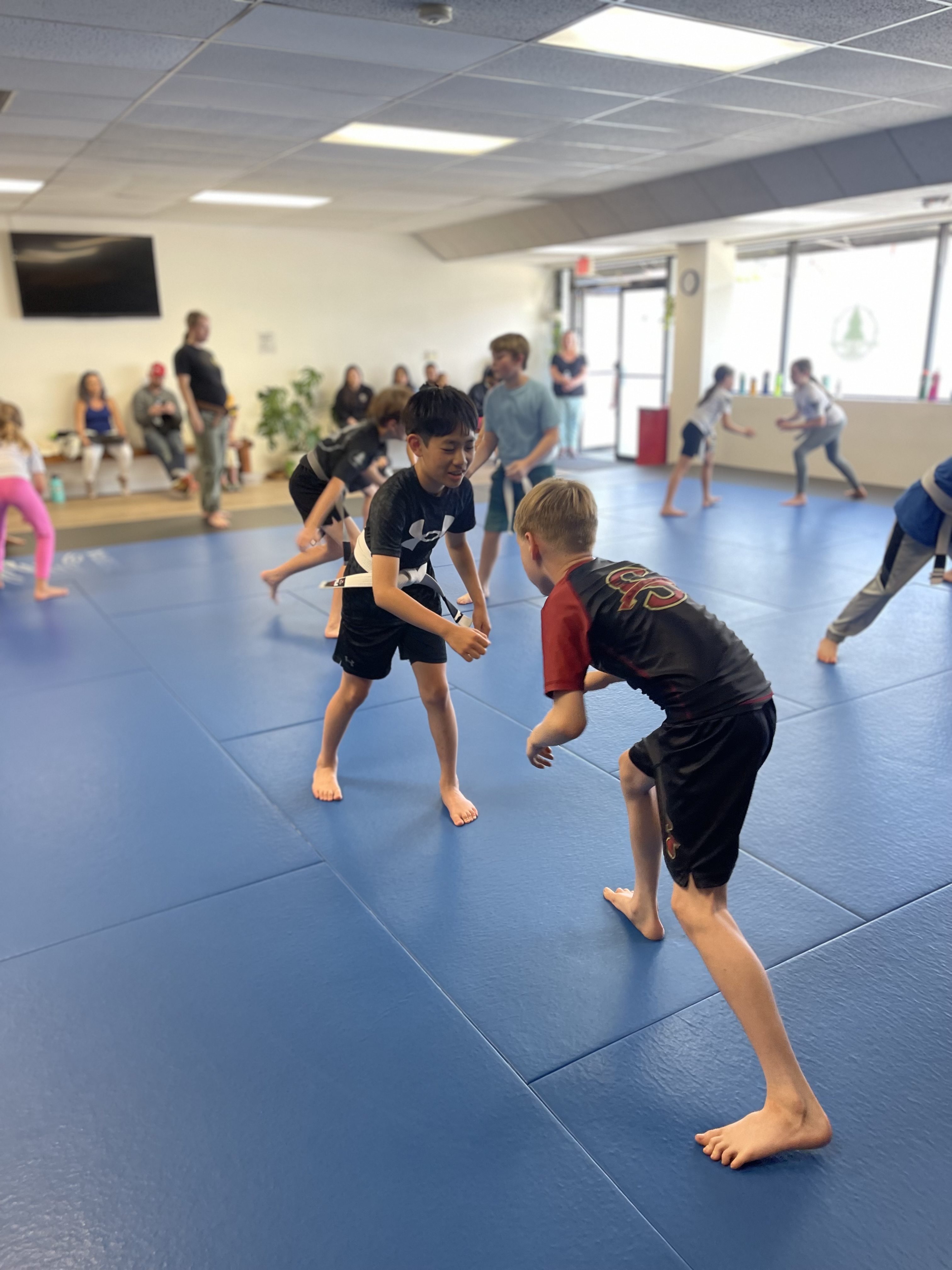 Kids learning Jiu-Jitsu at 10th Planet Tigard